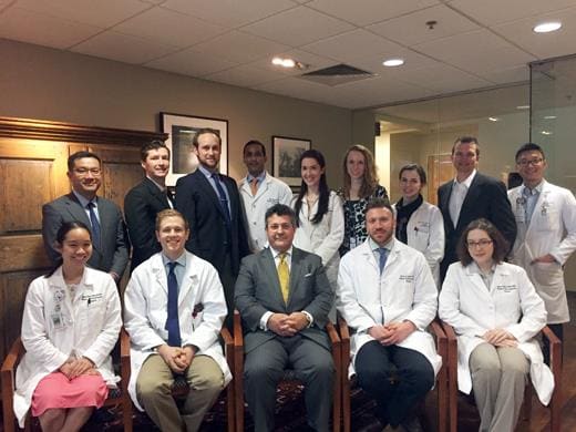 David Staffenberg, MD seated with several plastic surgery residents.