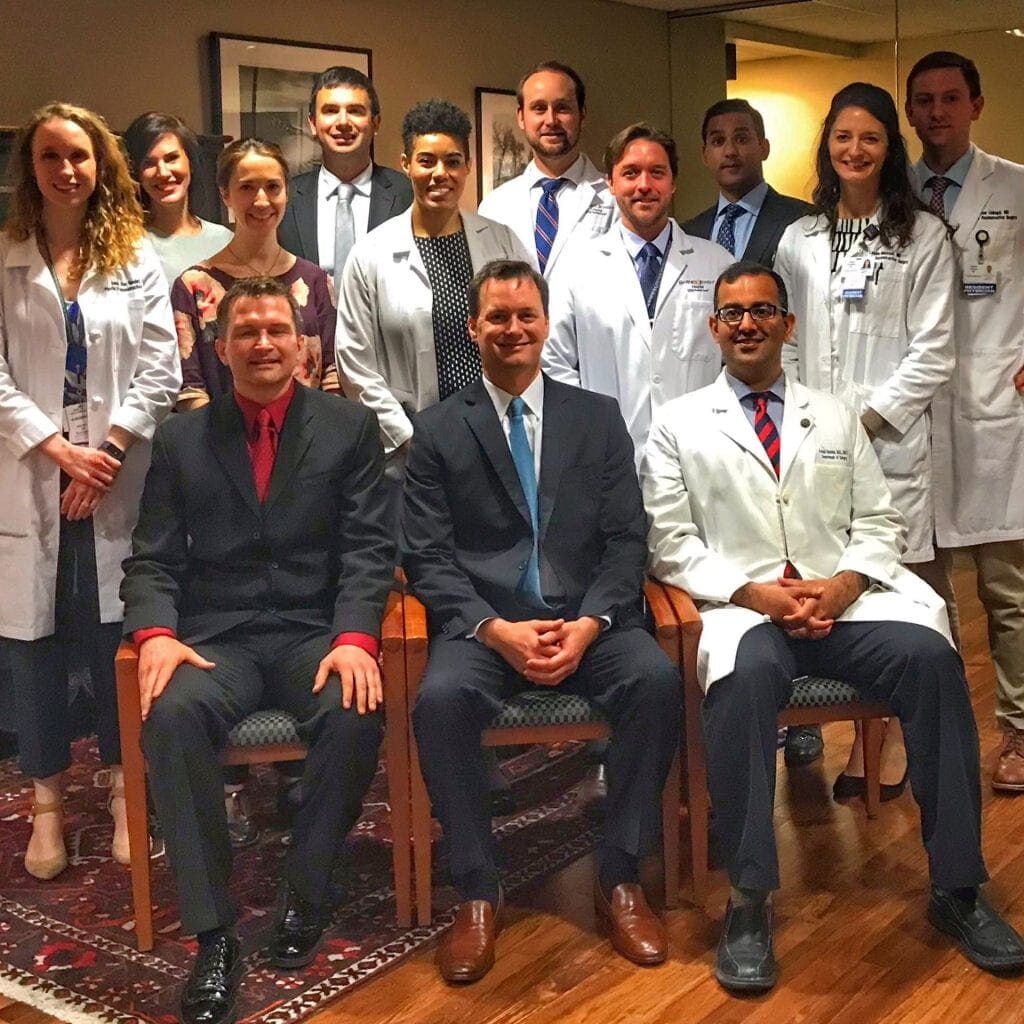 Dr. Patrick Garvey (seated in middle) with plastic surgery residents.