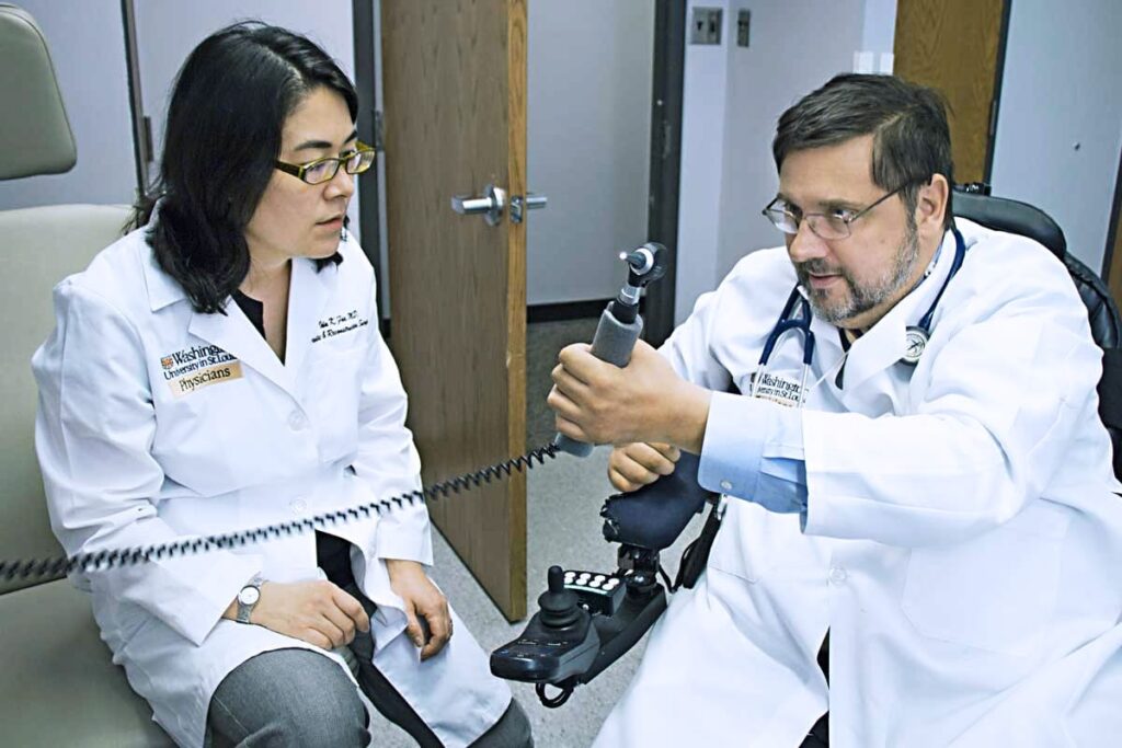 Ida Fox performing strength test with patient.